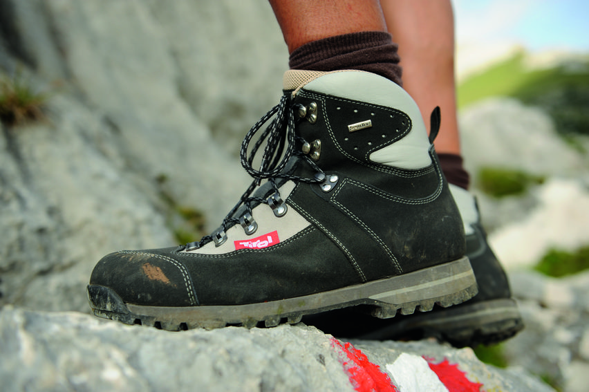 mountaineering shoes with the tirol logo on them